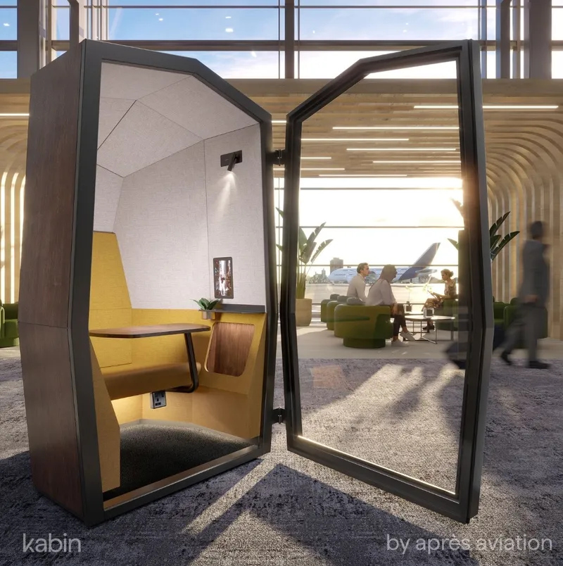 Interior view of Kabin by Après Aviation showing ergonomic seating and integrated touchscreen for secure airport working.